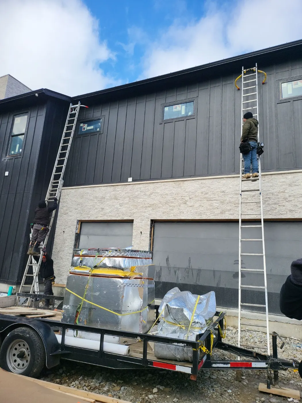 Tarping and dry-in on a Holliday Farms commercial roof